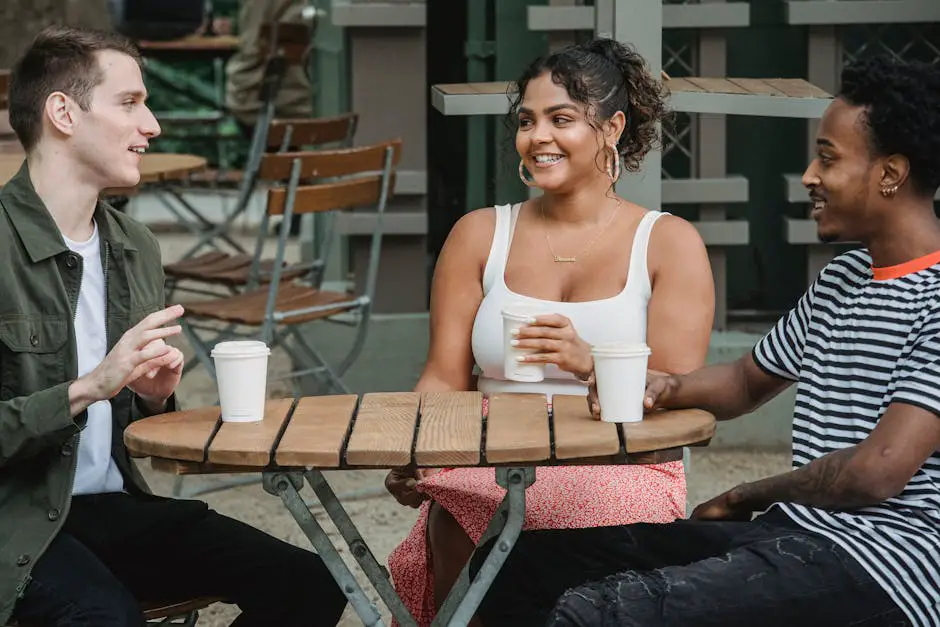 A group of diverse friends having a conversation at a cafe