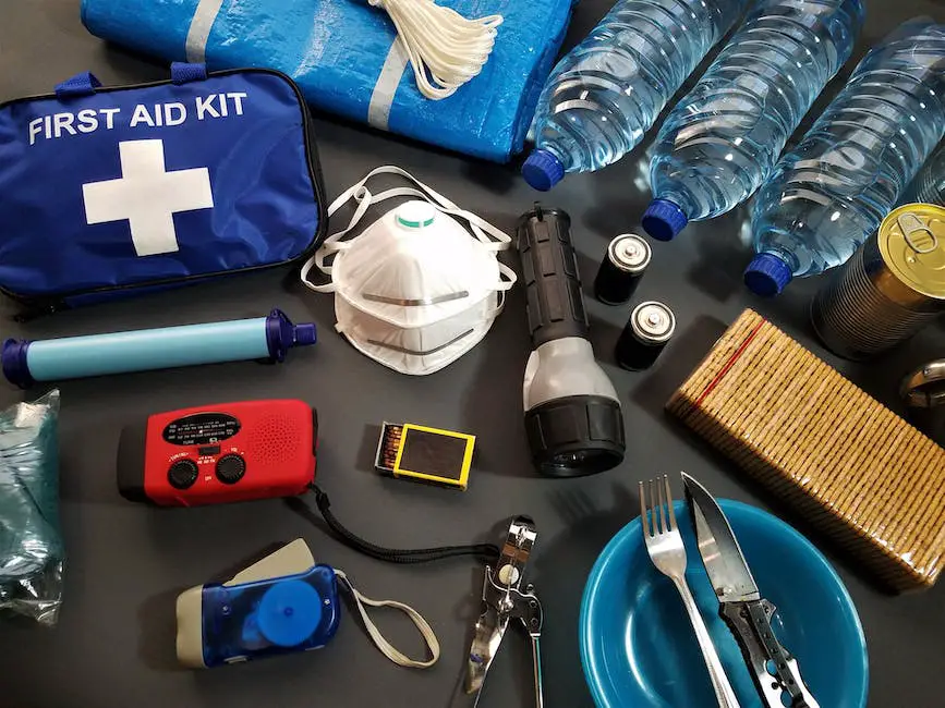 Image of a car survival kit with essential items such as water, snacks, blankets, a first-aid kit, a flashlight, and a change of clothes.