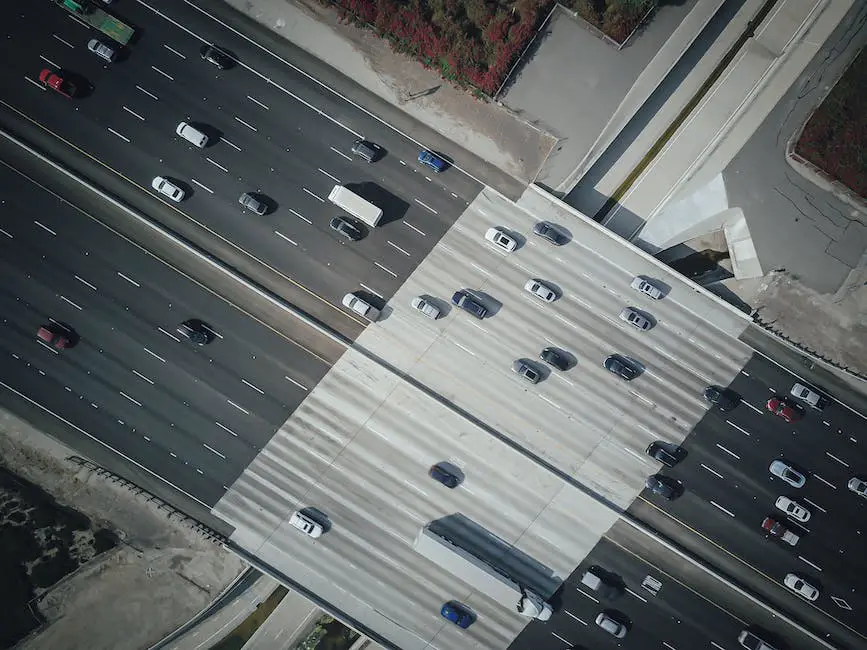 Conceptual image of cars lined up in a traffic jam with time lapsing above them to show the passing of time and frustration of the drivers.