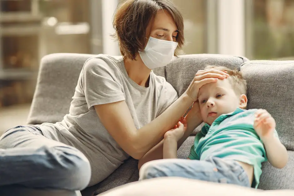 A worried looking mom looks at her sick child with a thermometer in hand.