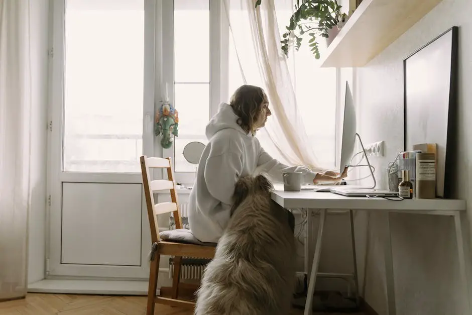 A person working from home with their pet beside them