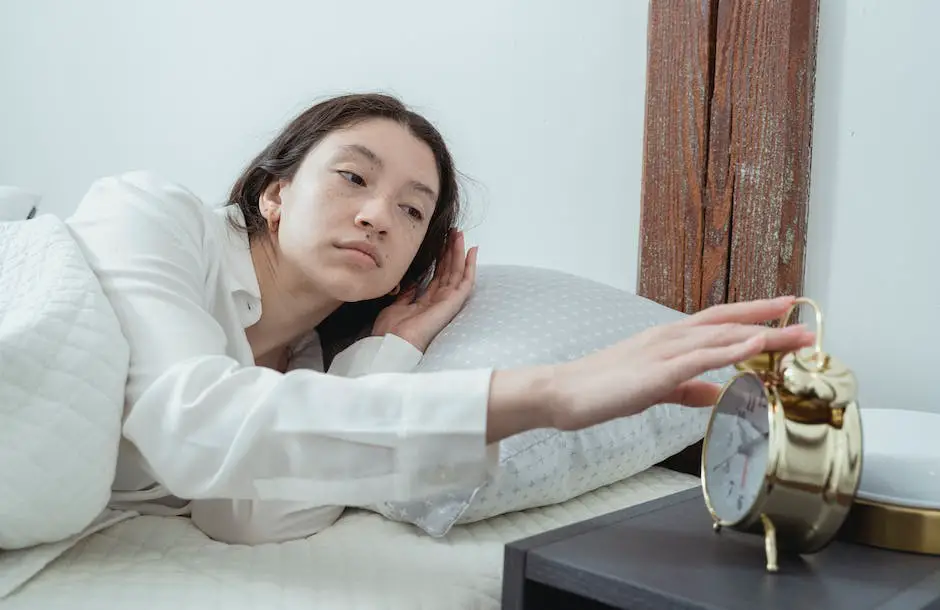 A person sleeping in bed with a bright red alarm clock in the background to indicate oversleeping