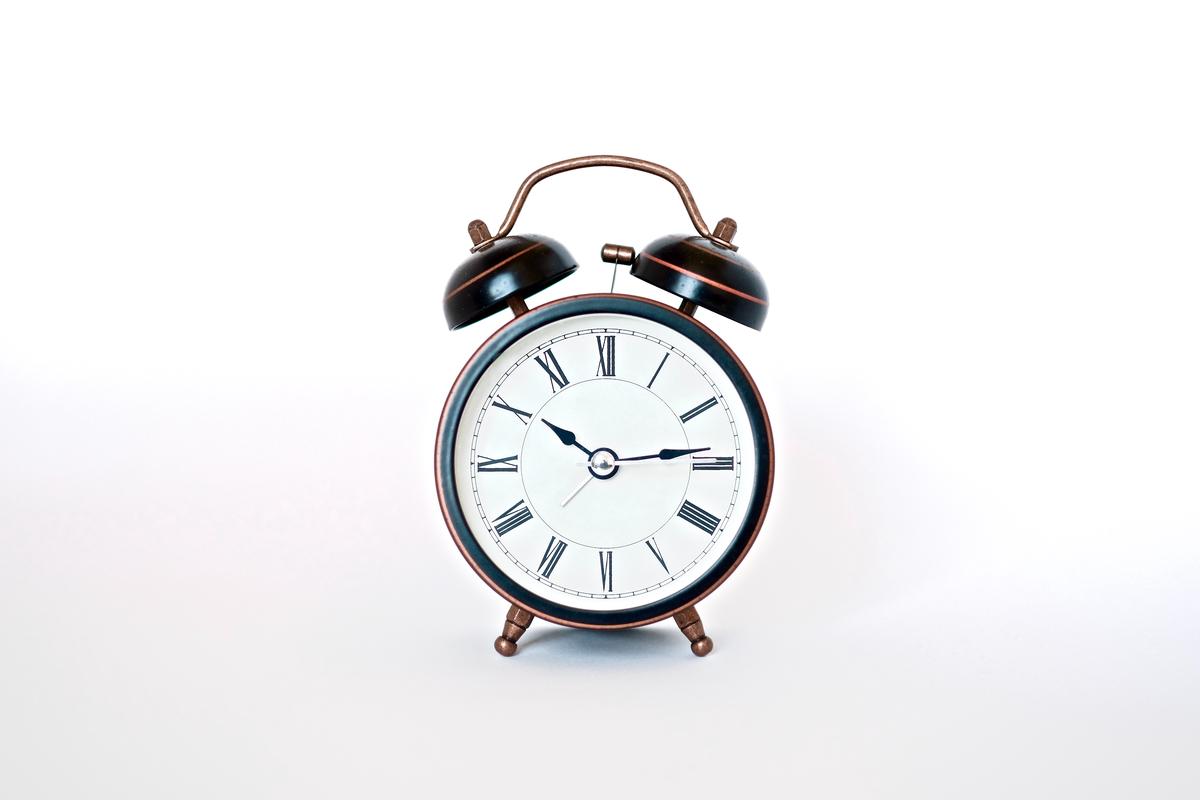 Simple tips to avoid oversleeping such as setting multiple alarms and placing your alarm clock across the room.