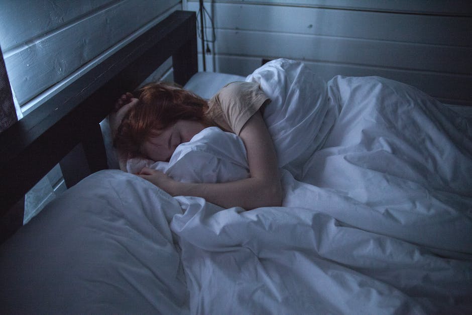 A person sleeping soundly on a comfortable bed with a caption of different ways to manage oversleeping.