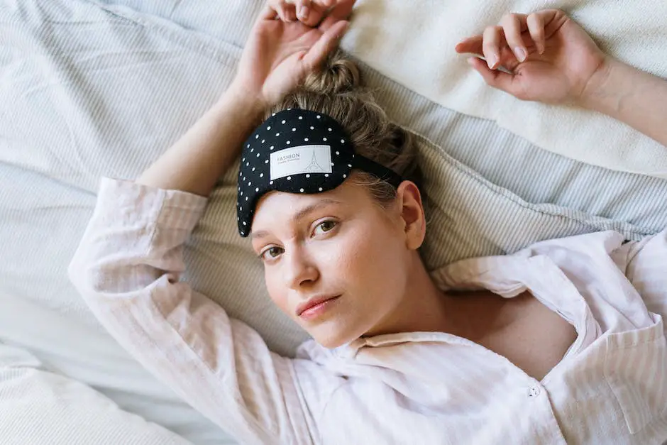 A person sleeping soundly in a comfortable bed with a sleep mask covering their eyes and a book resting on their chest.