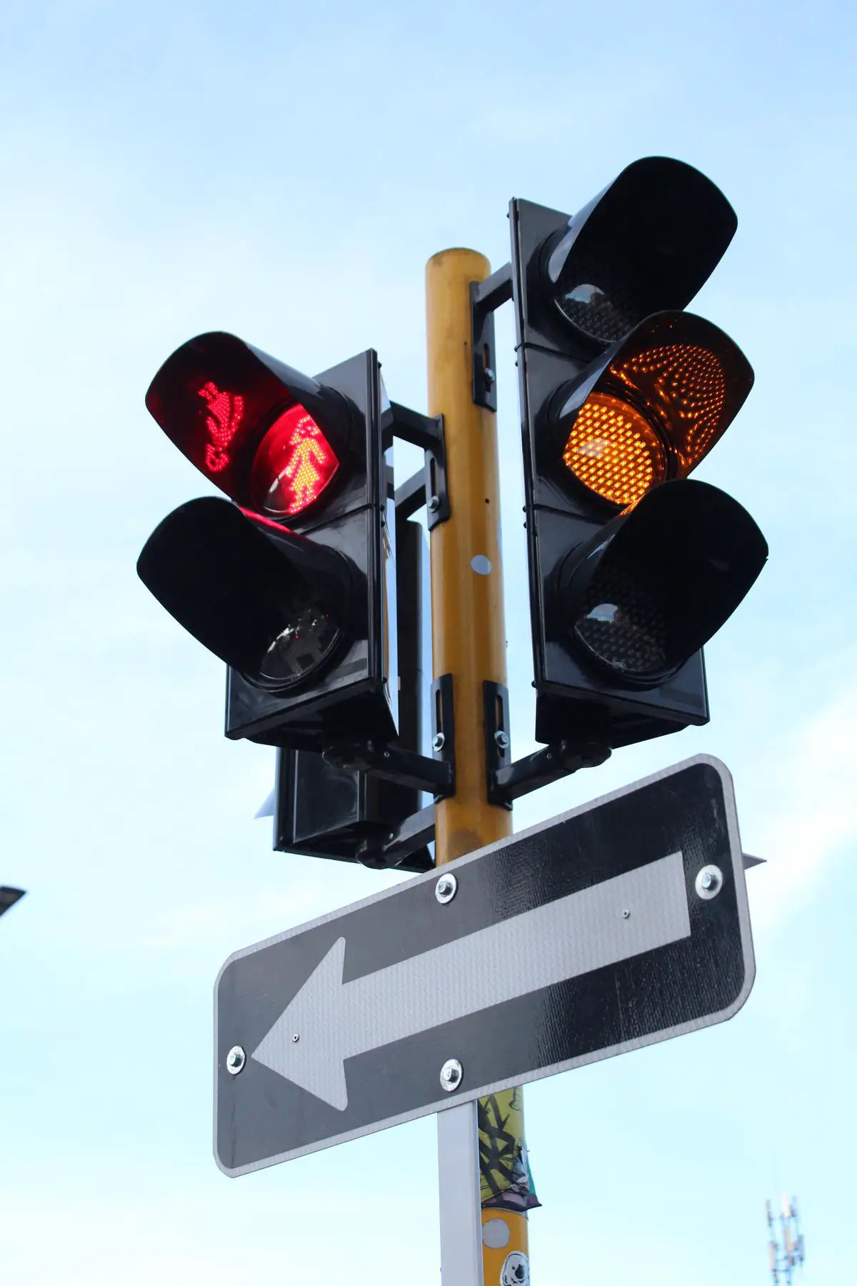 A red light on top of a traffic signal to show when vehicles should stop at intersections, contributing to traffic congestion.