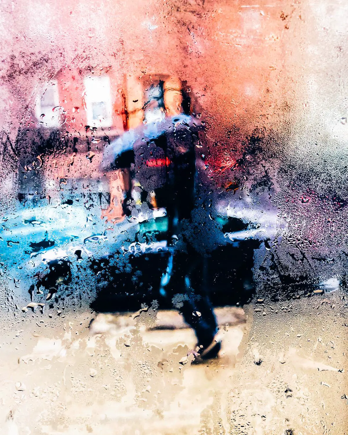 Image depicting a person holding an umbrella in heavy rain, symbolizing the concept of unforeseen circumstances.